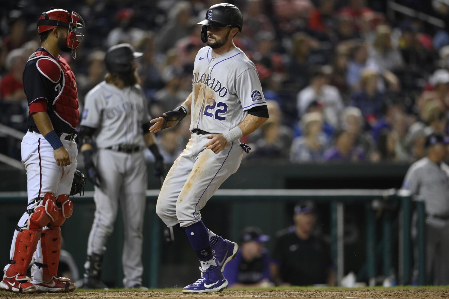 Elias Diaz of the Colorado Rockies celebrates with Brendan Rodgers