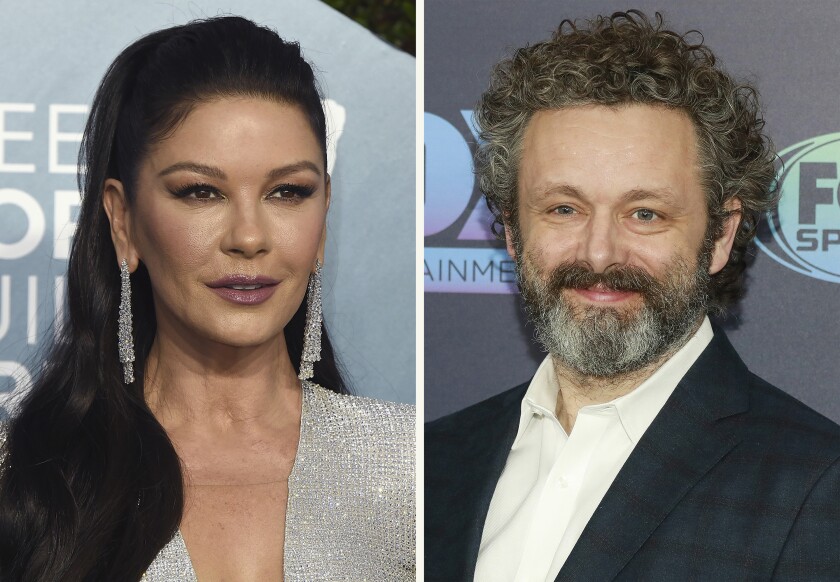 This combination photo shows Catherine Zeta-Jones, left, at the 26th annual Screen Actors Guild Awards on Jan. 19, 2020, in Los Angeles and Michael Sheen at the FOX Upfront party on May 13, 2019, in New York. The Welsh actors join "Prodigal Son" in the Tuesday, March 2, 20201, episode with Zeta-Jones playing a doctor and Sheen playing an incarcerated serial killer surgeon. (AP Photo)