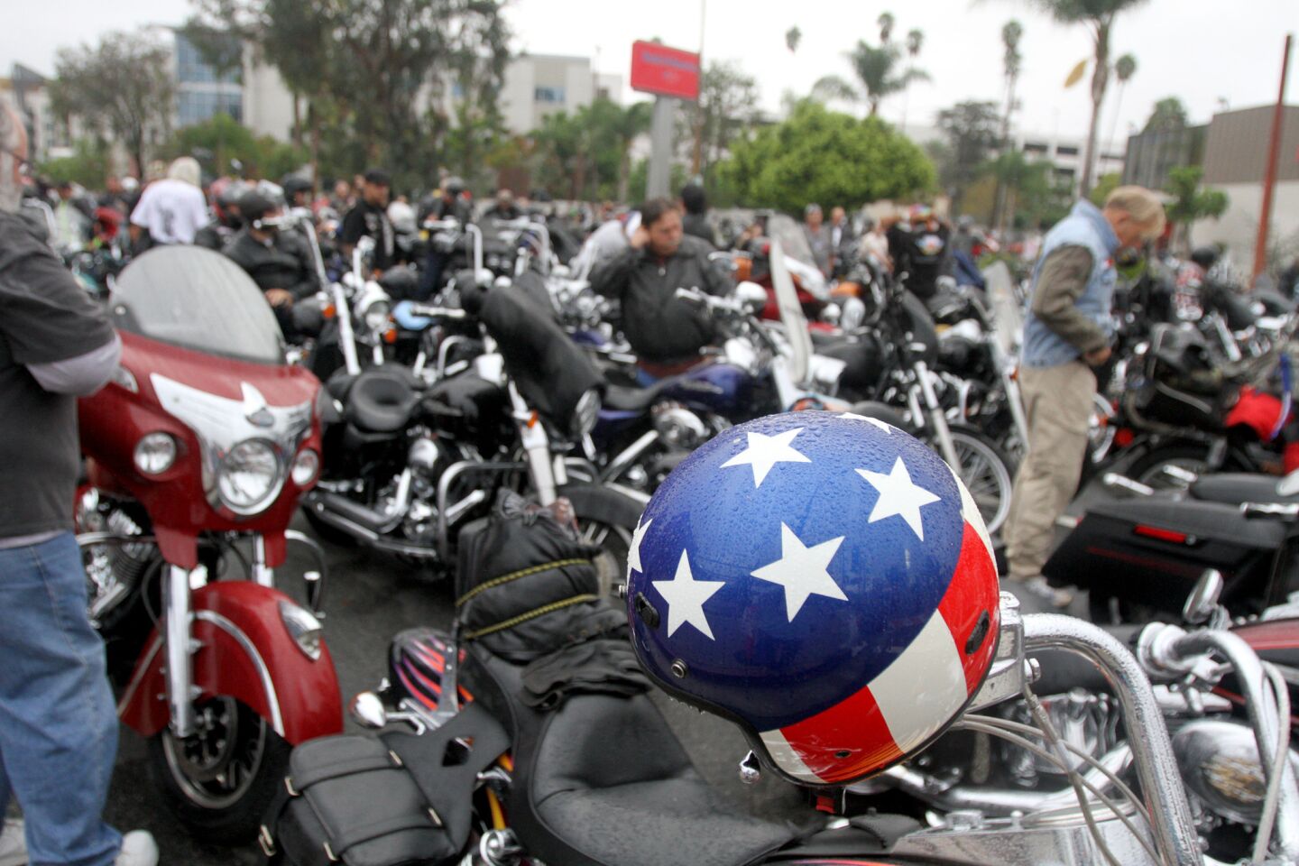 A patriotic helmet rests on a motorcycle prior to the start of the 32nd annual Love Ride at Harley-Davidson Motorcycles in Glendale on Sunday, October 18, 2015. This will be the last fundraising Love Ride.