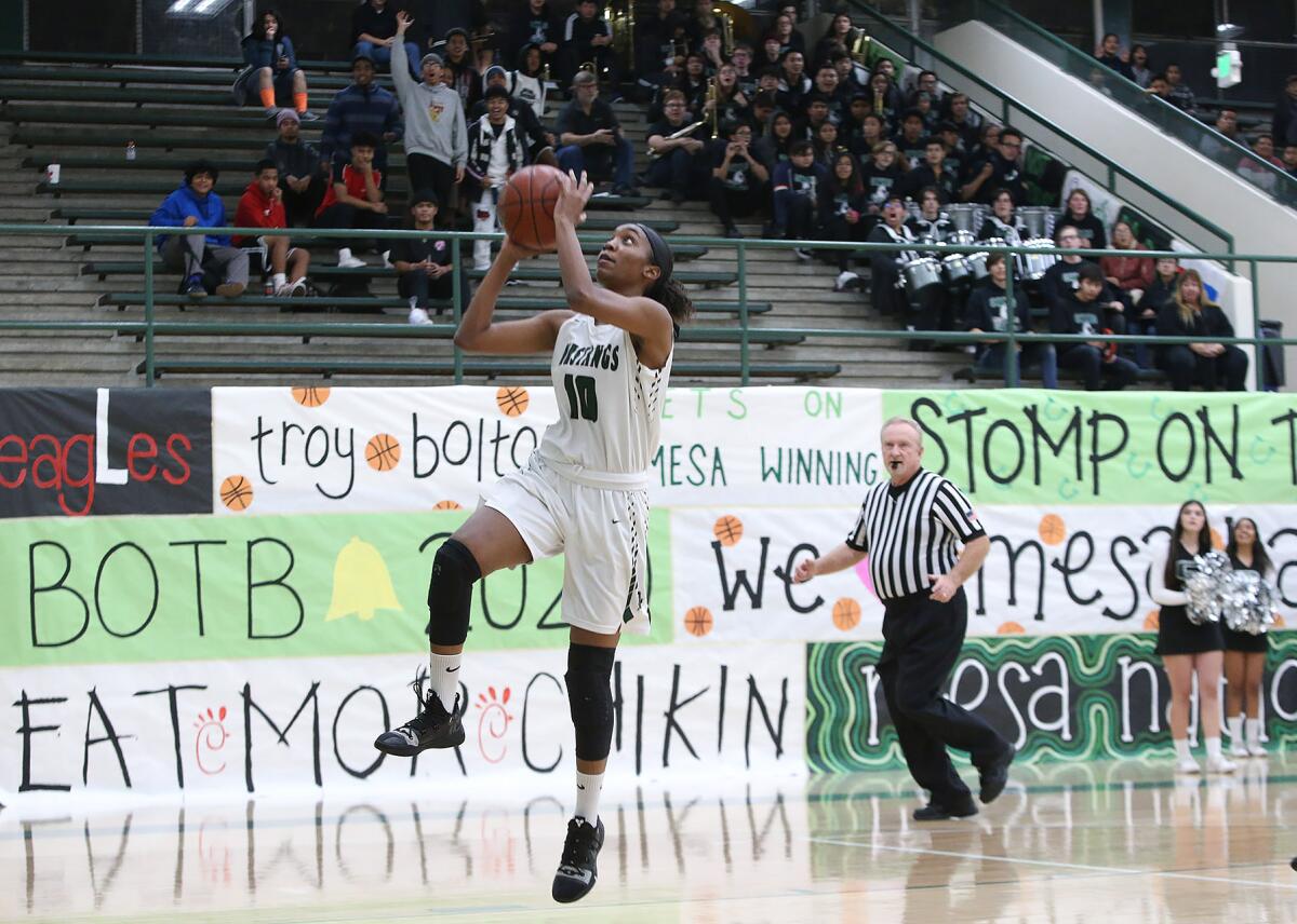 Costa Mesa's Tarah Harmon makes a layup off a steal in an Orange Coast League game at home against Estancia on Tuesday.