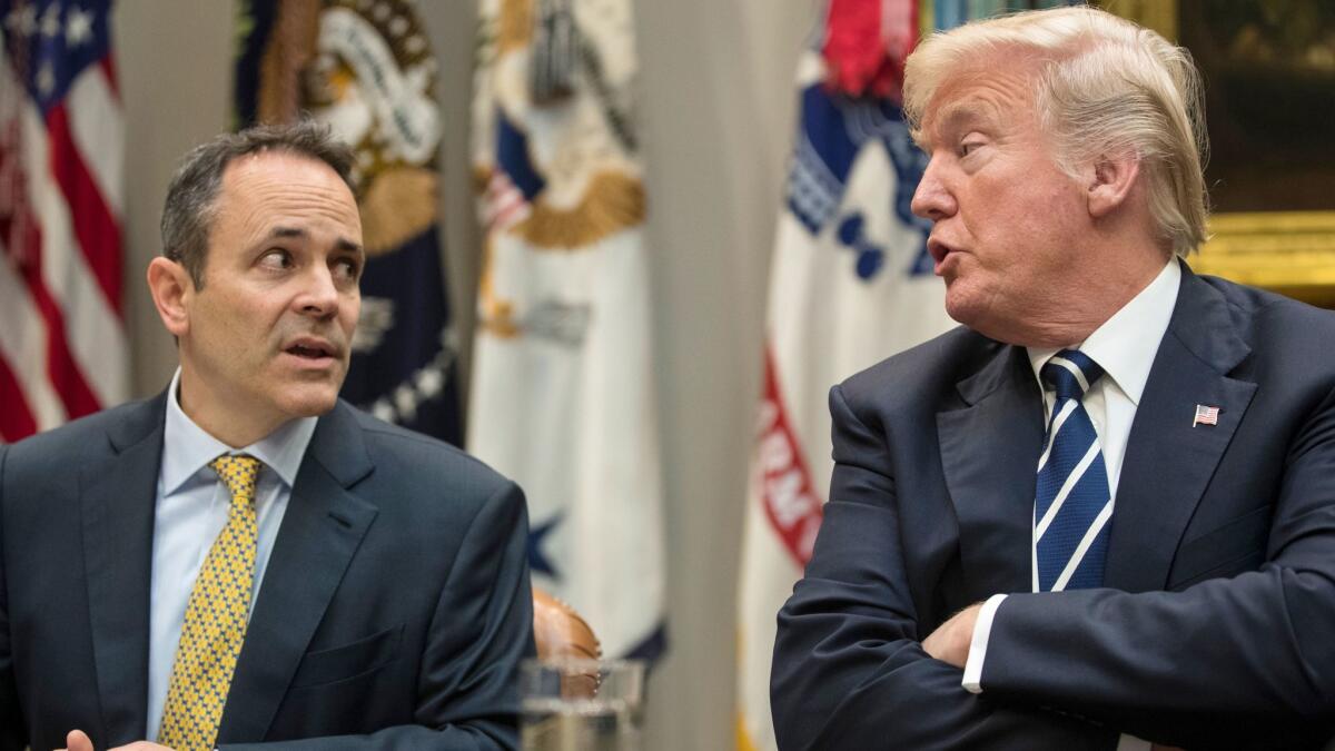 Connivers at throwing people off Medicaid: Kentucky Gov. Matt Bevin, left, and President Trump confer last week, days before the government approved punitive waivers of Medicaid rules for the state.