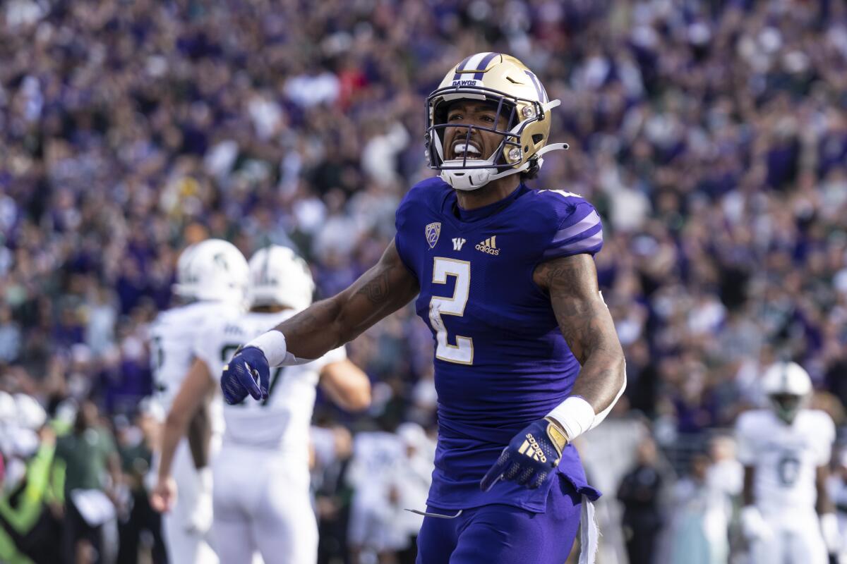 Washington wide receiver Ja'Lynn Polk celebrates after scoring a first-half touchdown Sept. 17, 2022.