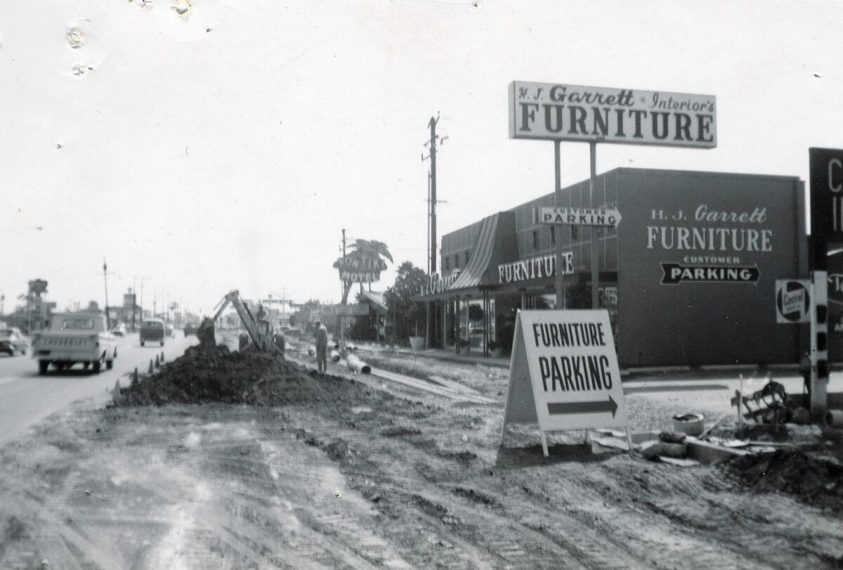 H.J. Garrett Furniture, pictured in 1963 during a Harbor Boulevard expansion project, is closing after more than five decades in business. It started in 1960 down the street on Park Avenue.