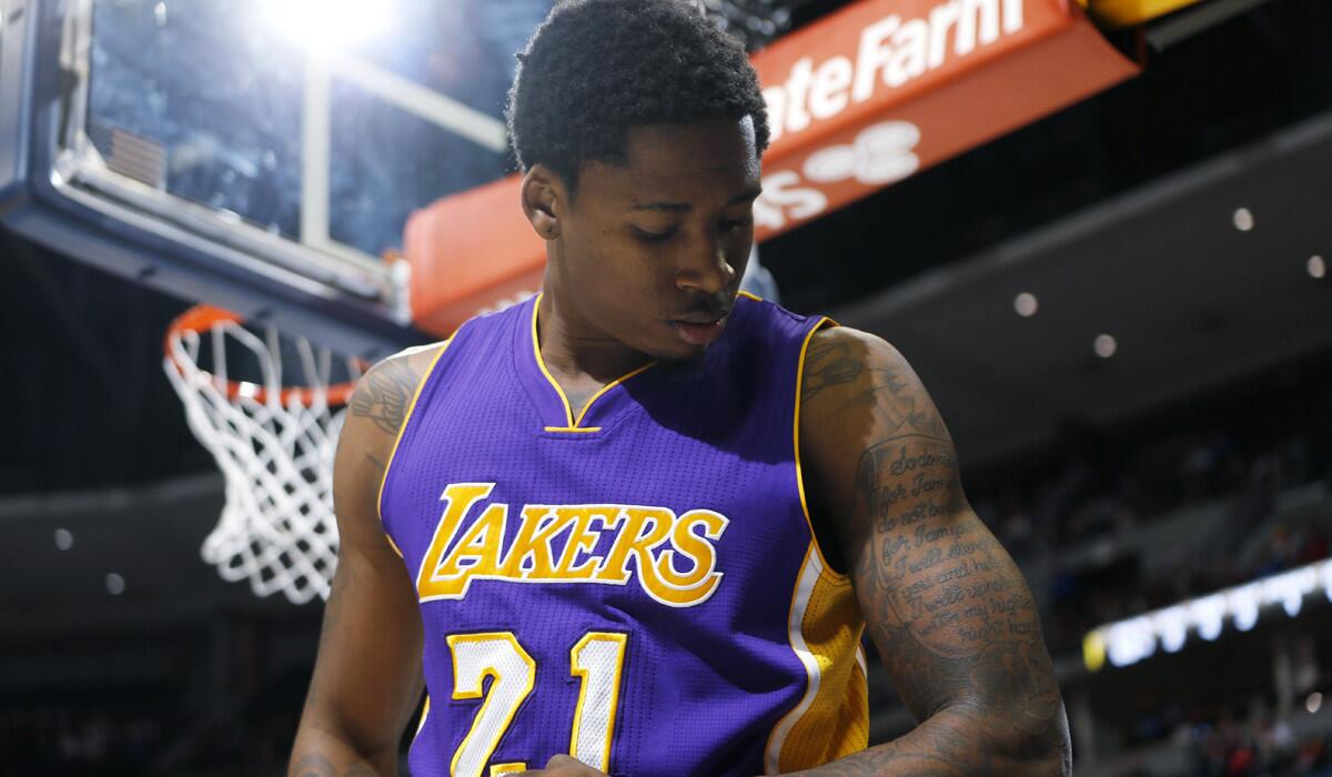 Lakers forward Ed Davis flexes after dunking against the Denver Nuggets on April 8.