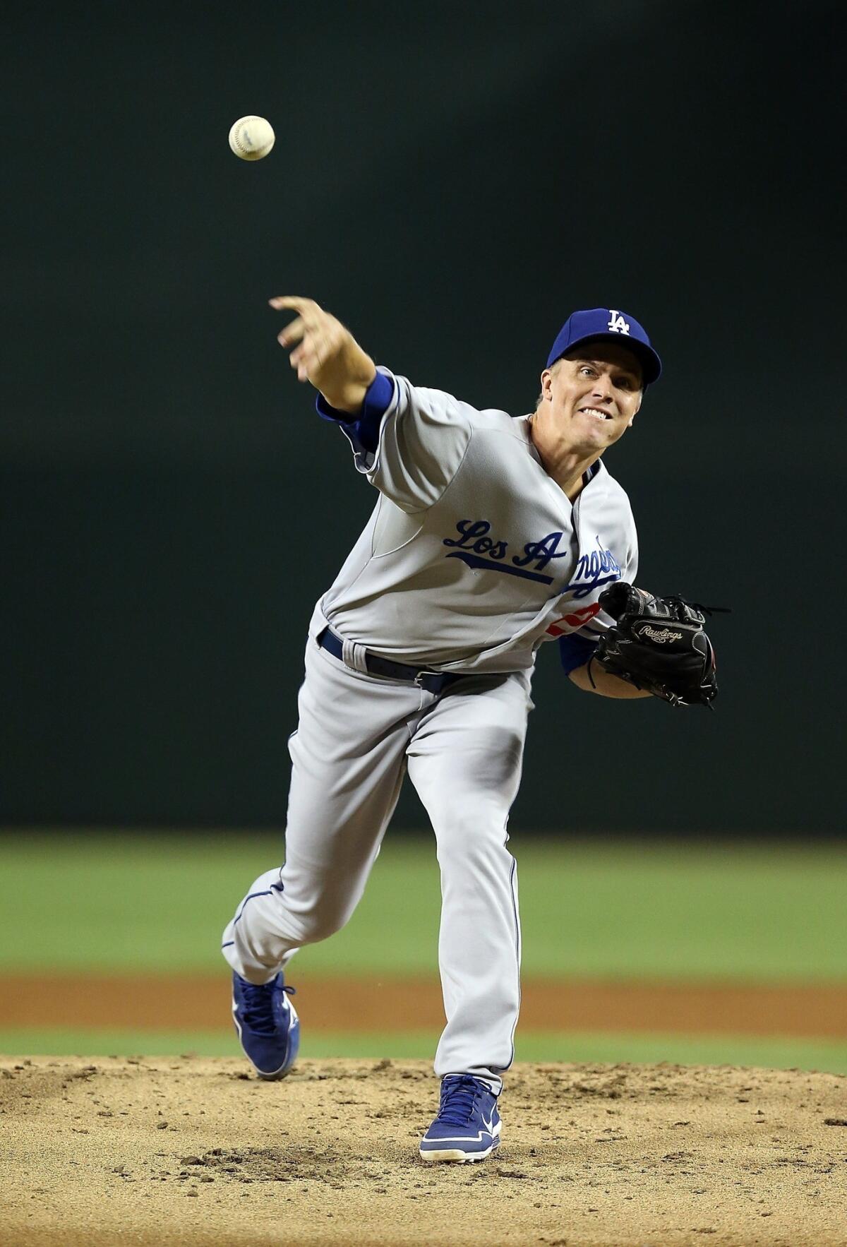 Dodgers starter Zack Greinke delivers a pitch during the team's 6-1 victory over the Arizona Diamondbacks on Monday.