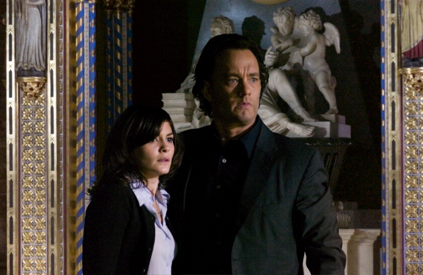 A woman, left, and a man look scared in a museum