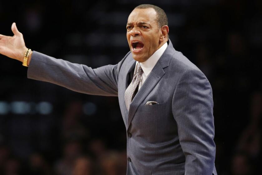 Brooklyn Nets head coach Lionel Hollins shouts at the referee in the first half of an NBA basketball game, Sunday, Nov. 29, 2015, in New York. (AP Photo/Kathy Willens) ORG XMIT: NYKW106