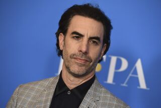 FILE - In this Wednesday, July 31, 2019 file photo, Sacha Baron Cohen arrives at the 2019 Hollywood Foreign Press Association's Annual Grants Banquet at the Beverly Wilshire Beverly Hills, Calif. Actor Sacha Baron Cohen, who stars in “Borat Subsequent Moviefilm,” donated $100,000 to the church of a woman who believed she was taking part in a documentary but instead was being featured in the mockumentary comedy film. (Photo by Jordan Strauss/Invision/AP, File)