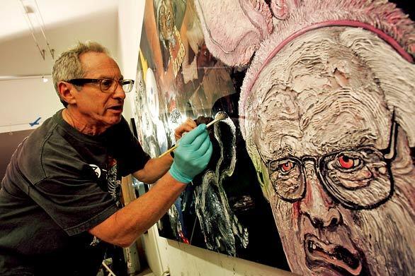 Artist Robbie Conal is seen applying paint to a grotesque image of Dick Cheney on a canvas