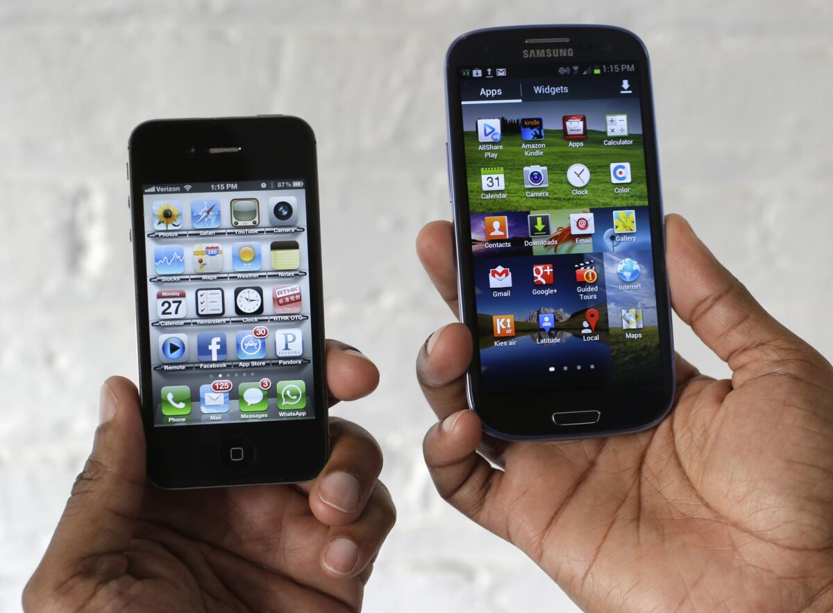 The Apple iPhone 4s, left, is displayed next to the Samsung Galaxy S III. The Supreme Court is to review a dispute over smartphone features for which Apple holds patents: the flat screen, the rectangular shape with rounded corners, a rim and a screen of icons.