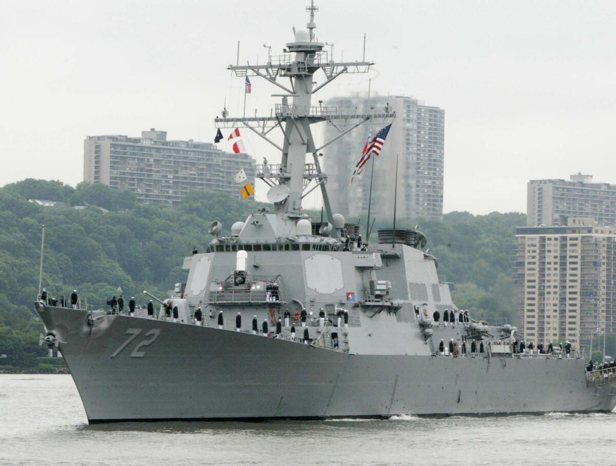 In this May 26, 2004 file photo, the USS Mahan, a guided-missile destroyer, moves up the Hudson River in New York during Fleet Week. A sailor was fatally shot aboard the USS Mahan at Naval Station Norfolk late Monday, March 24, 2014, and security forces killed a male civilian suspect, base spokeswoman Terri Davis said.