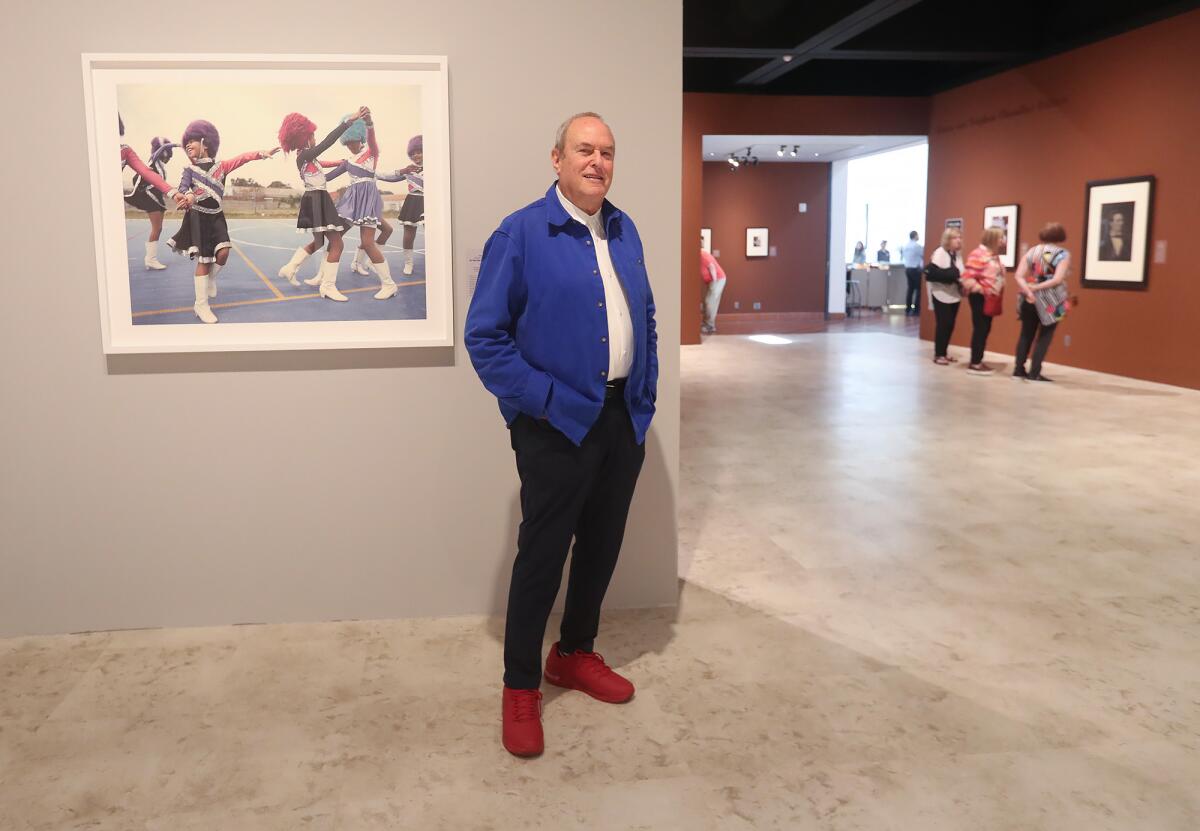 Curator Peter Fetterman stands with his collection of photographs in Santa Ana.