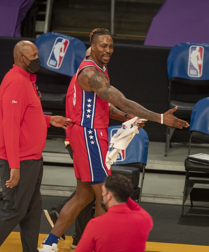 A player is led off the basketball court