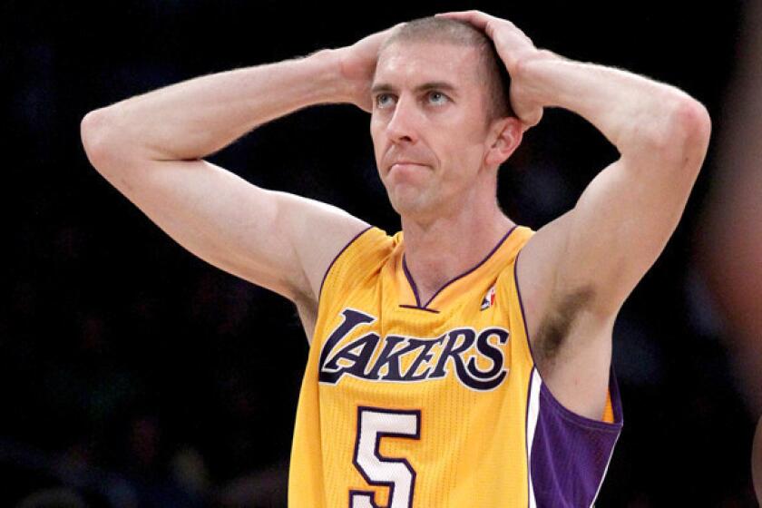 Lakers guard Steve Blake reacts after committing a foul against the Warriors during an early-season game at Staples Center.