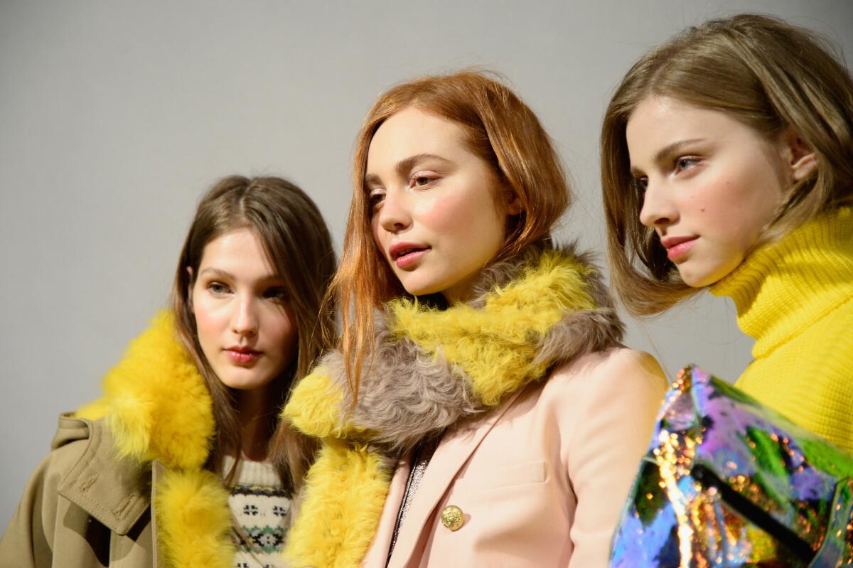Models pose at the J. Crew presentation during New York Fashion Week Fall-Winter 2015.