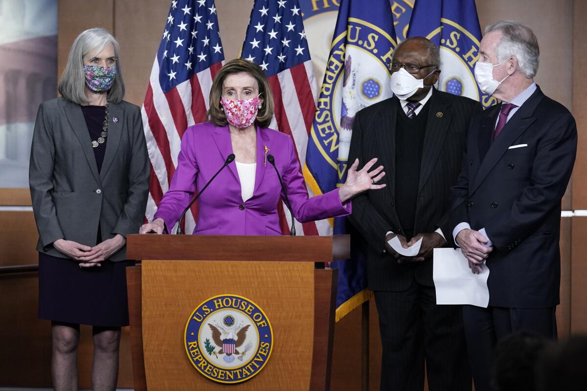 Speaker of the House Nancy Pelosi, D-Calif., holds a news conference ahead of the vote on the Democrat's $1.9 trillion COVID-19 relief bill, at the Capitol in Washington, Tuesday, March 9, 2021, as Rep. Katherine Clark, D-Mass., Majority Whip James Clyburn, D-S.C. and Budget Ways and Means Committee Chairman Richard Neal, D-Mass., look on. (AP Photo/J. Scott Applewhite)