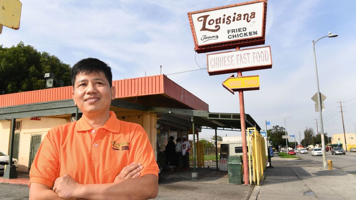 Franchise owner Michael Eng stands outside his Louisiana Famous Fried Chicken in South L.A. Eng came to the states when he was 18 and now owns the chain.