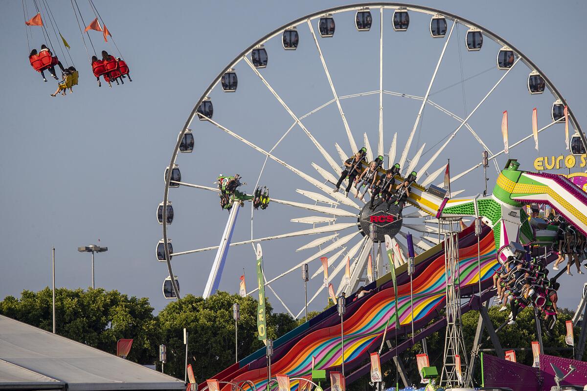 Orange County Fair visitors get their thrills on rides during the fair's 2019 run in Costa Mesa.