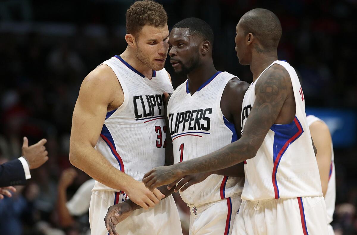 Clippers forward Lance Stephenson is encouraged by teammates Blake Griffin and Jamal Crawford after a productive first half against the Indiana Pacers at Staples Center on Dec. 2.