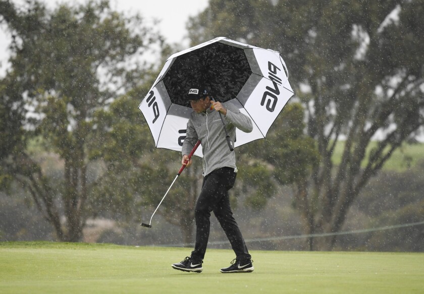 Norway's Viktor Hovland battles the elements during the second round of the Farmers Insurance Open on Friday at Torrey Pines.