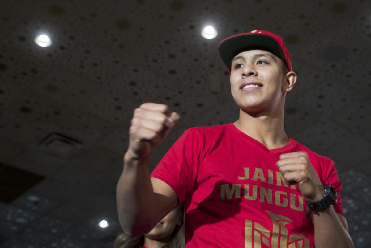 Boxer Jaime Munguia poses with his fists up