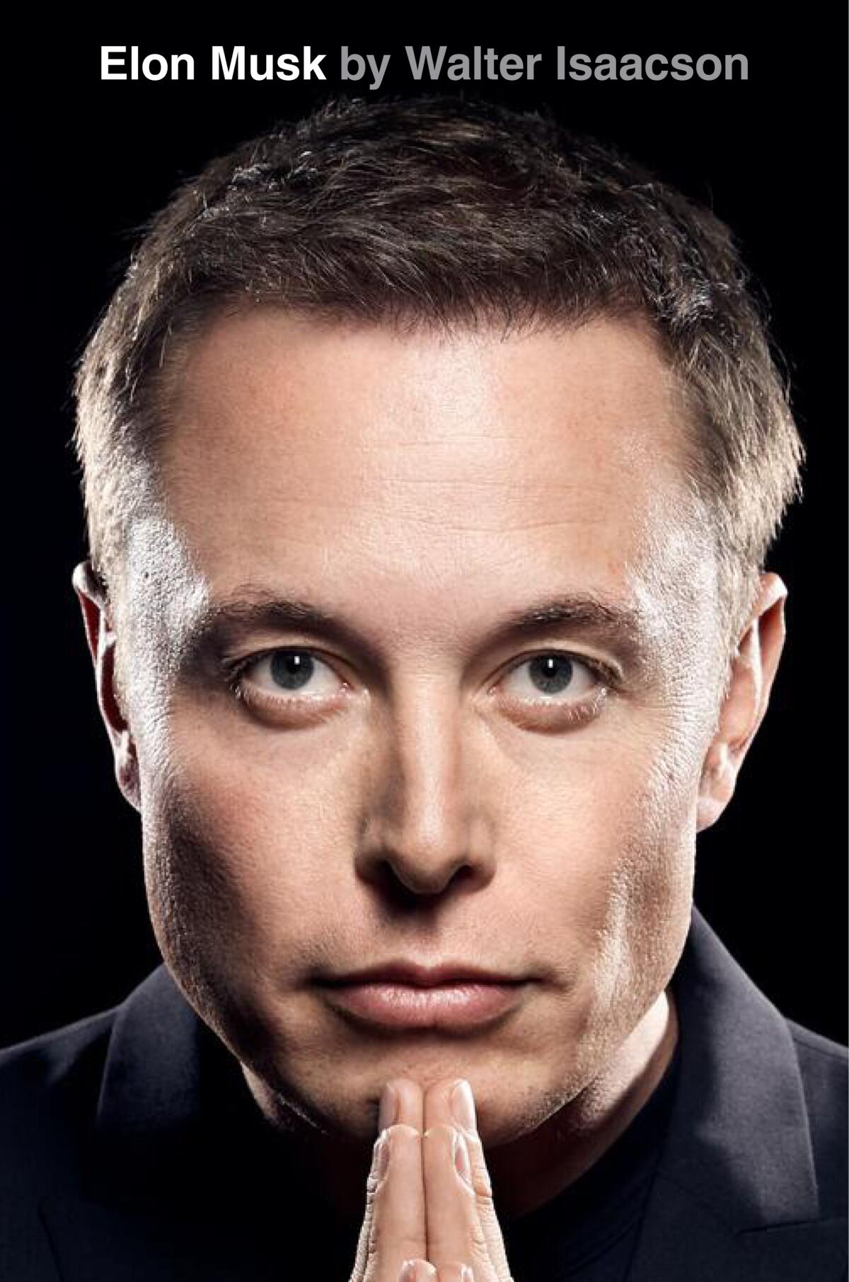 The cover of "Elon Musk," by Walter Isaacson, shows Musk head on, "prayer hands" beneath his chin
