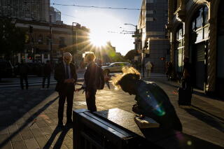 A range of people on Market Street in downtown San Francisco on Thursday.