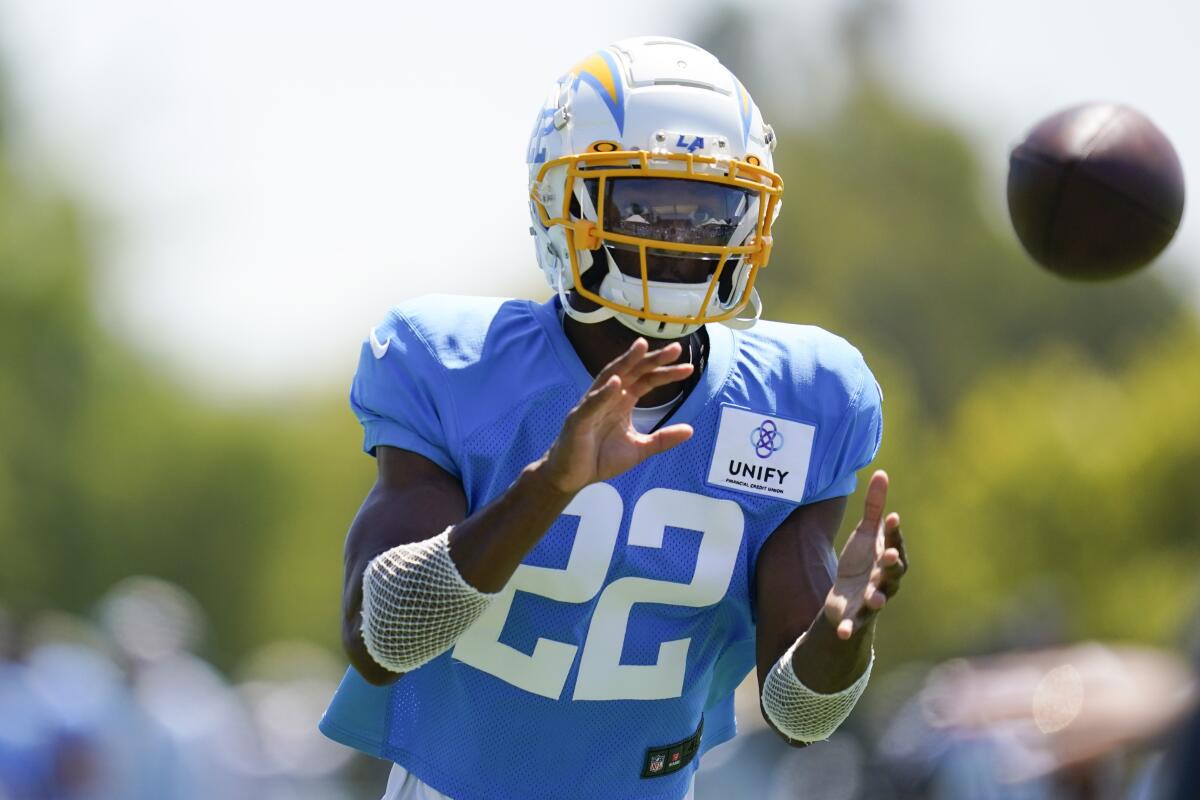 Chargers safety JT Woods participates in drills at training camp in August 2022.