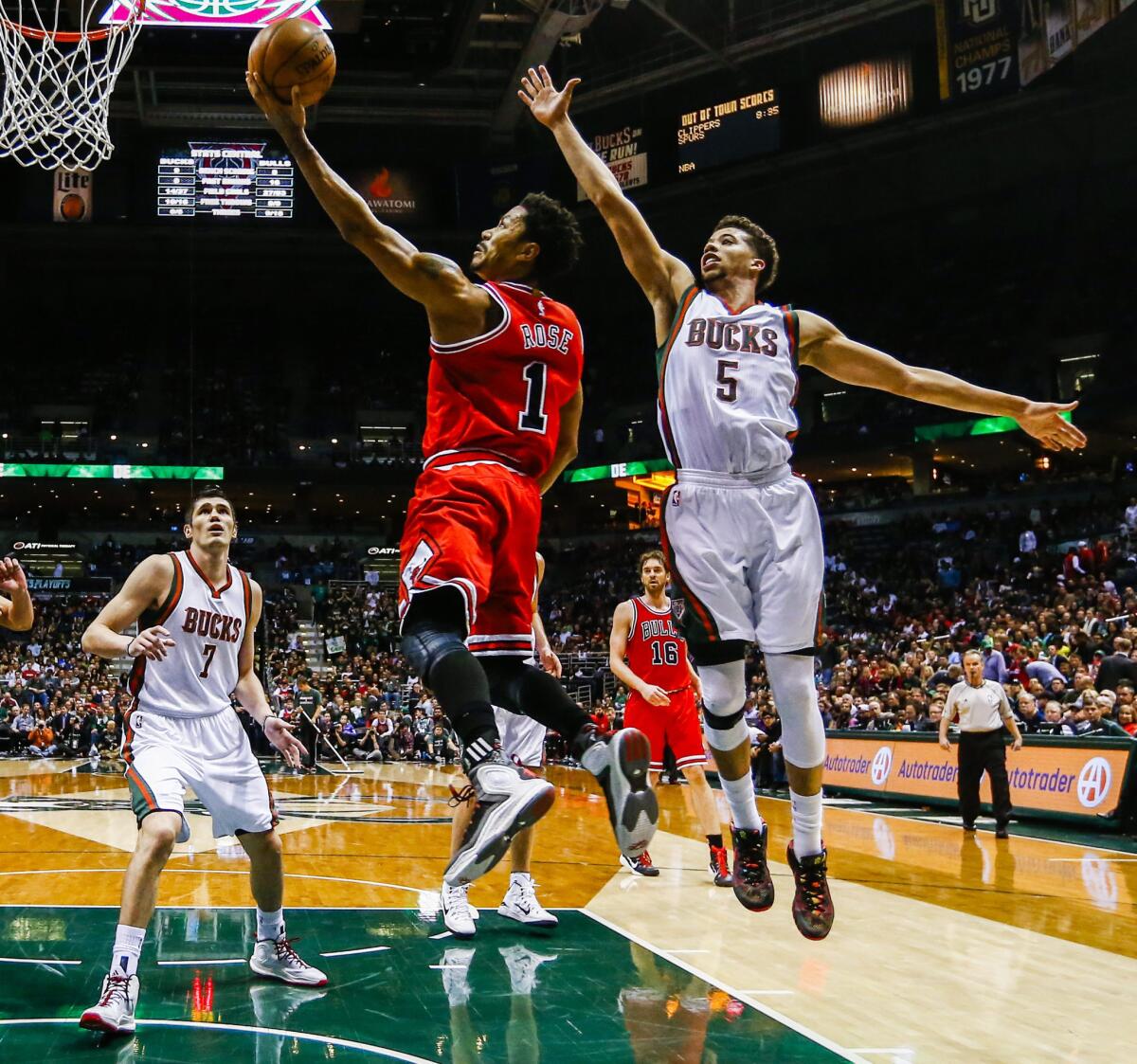 Bulls guard Derrick Rose goes by Bucks point guard Michael Carter-Williams. The Bulls routed Milwaukee by 54 points.