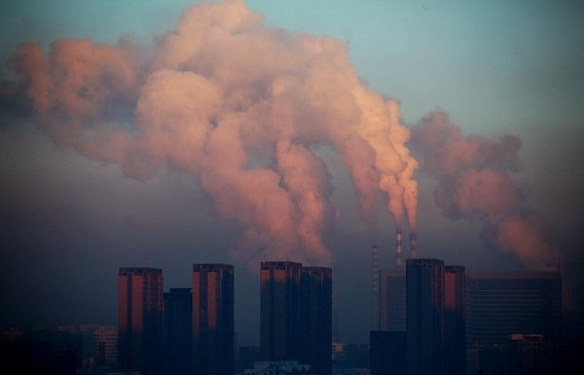A power plant discharges pollution into the air in China. The burning of fossil fuels has contributed to an unprecedented buildup of carbon dioxide in Earth's atmosphere.