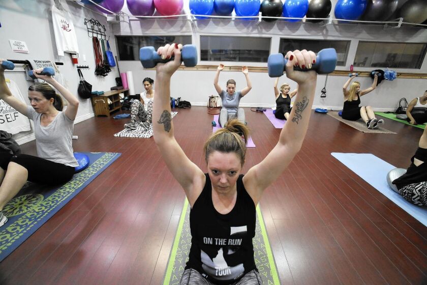 Melissa Keklak participates in a body sculpting class at SC Fitness in North Hollywood.