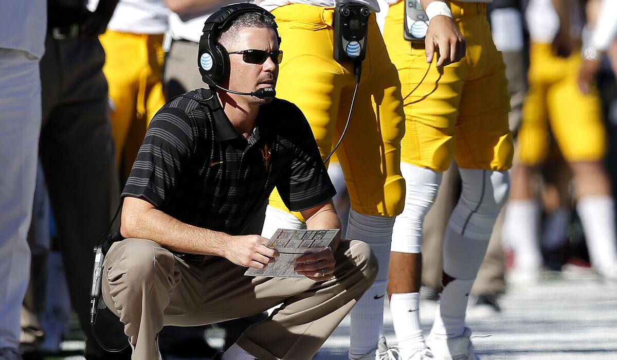 Former Arizona State offensive coordinator, Mike Norvell, watches from the sidelines during a game against Arizona on Nov. 28, 2014.