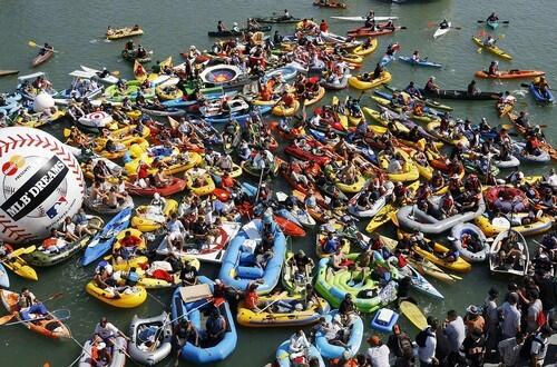 Spectators sit in their boats and rafts in McCovey Cove as they wait for the start of the All-Star Home Run Derby in San Francisco.