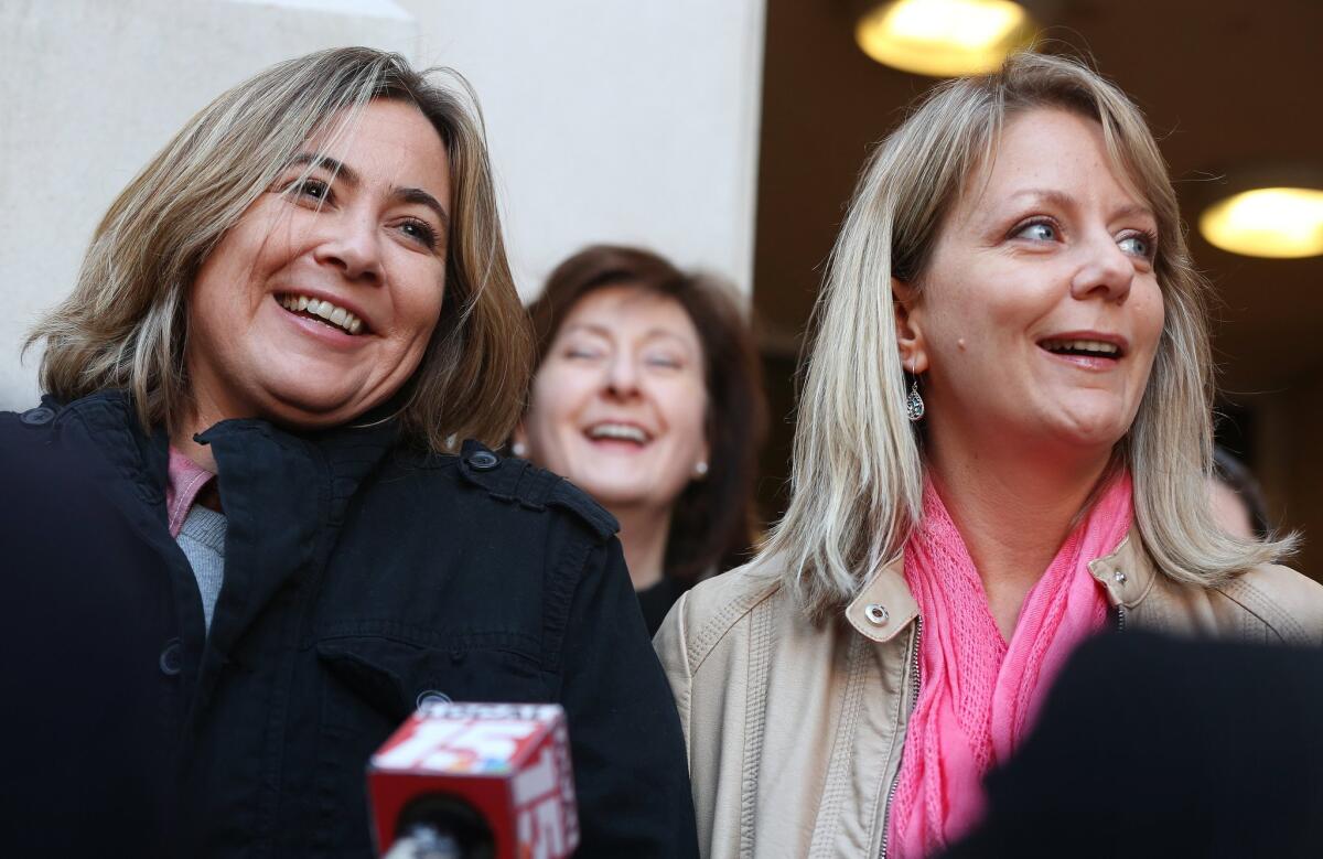 Cari Searcy, left, and Kim McKeand, plaintiffs in the Alabama same-sex marriage case, hold a news conference in front of the Mobile County Marriage License Office in Mobile, Ala., on Jan. 26.