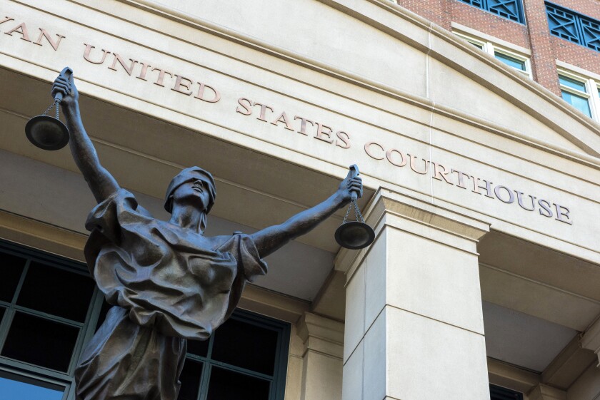 FILE - The U.S. Courthouse is seen in Alexandria, Va., Thursday, Sept. 2, 2021. A woman who once lived in Kansas has been arrested after federal prosecutors charged her with joining the Islamic State group and leading an all-female battalion of AK-47 wielding militants. The U.S. Attorney in Alexandria, announced Saturday, Jan. 29, 2022, that 42-year-old Allison Fluke-Ekren has been charged with providing material support to a terrorist organization. (AP Photo/Cliff Owen, File)