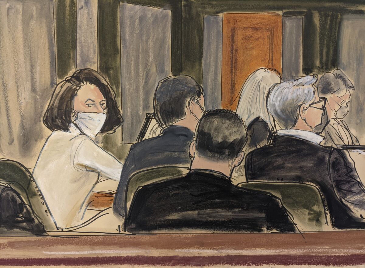 In a courtroom sketch, Ghislaine Maxwell sits at the defense table