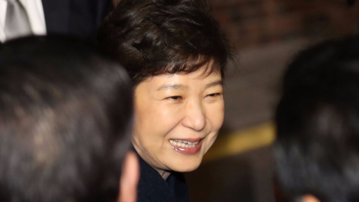 Former South Korea President Park Geun-Hye arrives Sunday at her private residence in Seoul.