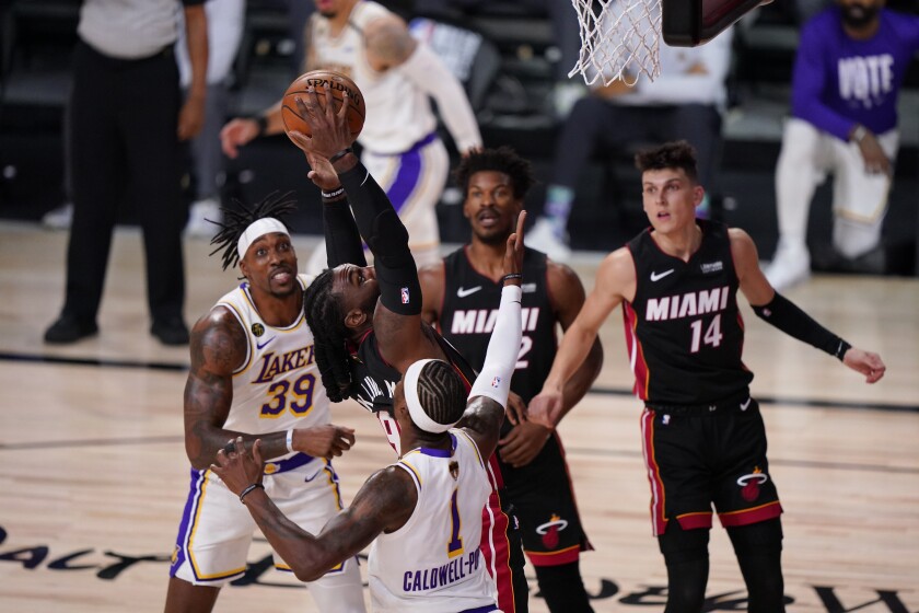 Heat forward Jae Crowder and Lakers guard Kentavious Caldwell-Pope battle for ar ebound during Game 3.