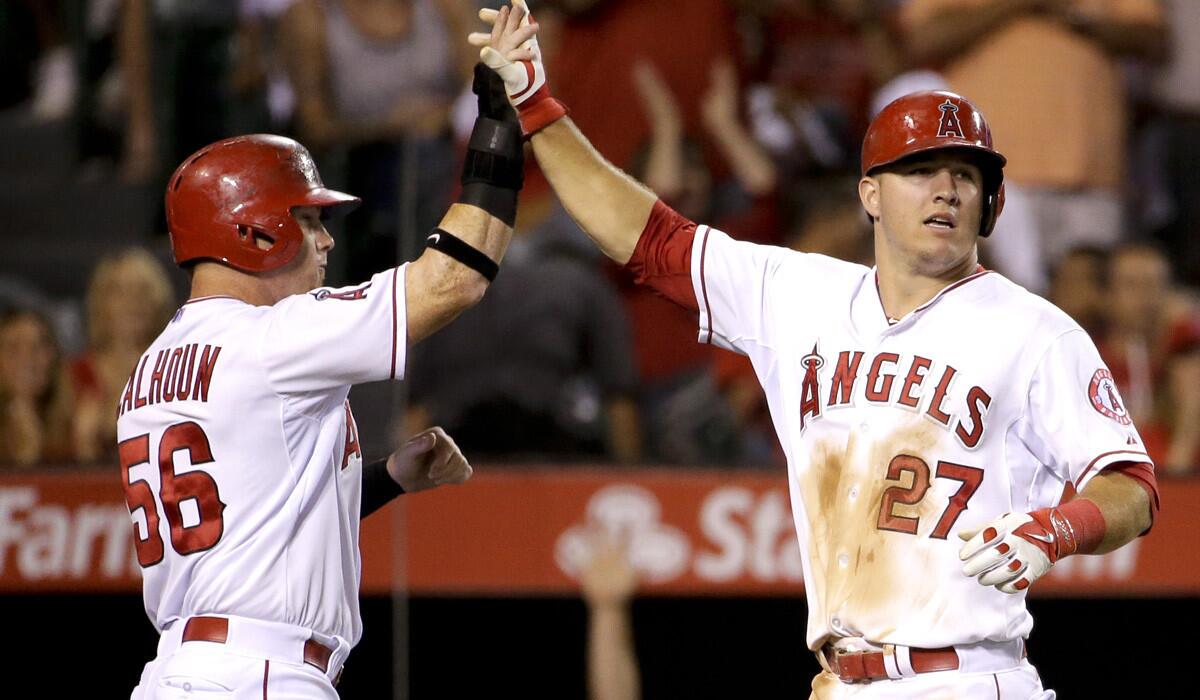 While center fielder Mike Trout (27) is the more celebrated Angels player, it's right fielder Kole Calhoun (56) who is the only major leaguer with 10 homers, 50 runs and a .300 average since June 1.