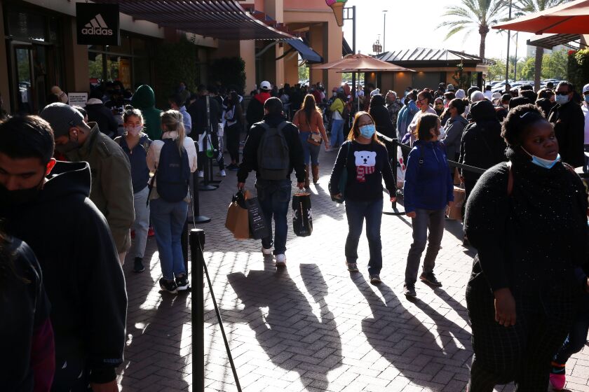 1LOS ANGELES, CA - NOVEMBER 27: People shop at the Citadel Outlets in Commerce on Friday, Nov. 27, 2020 in Los Angeles, CA. Although the mall was less crowded than in previous years, shoppers still came out for sales and promotions despite the pandemic. (Dania Maxwell / Los Angeles Times)