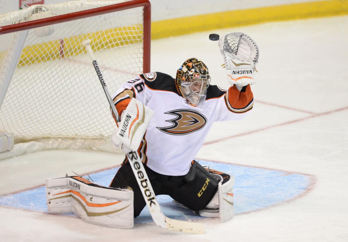Anaheim goalie John Gibson reaches for the puck in a game against the Blues in St. Louis on Oct. 30, 2014.