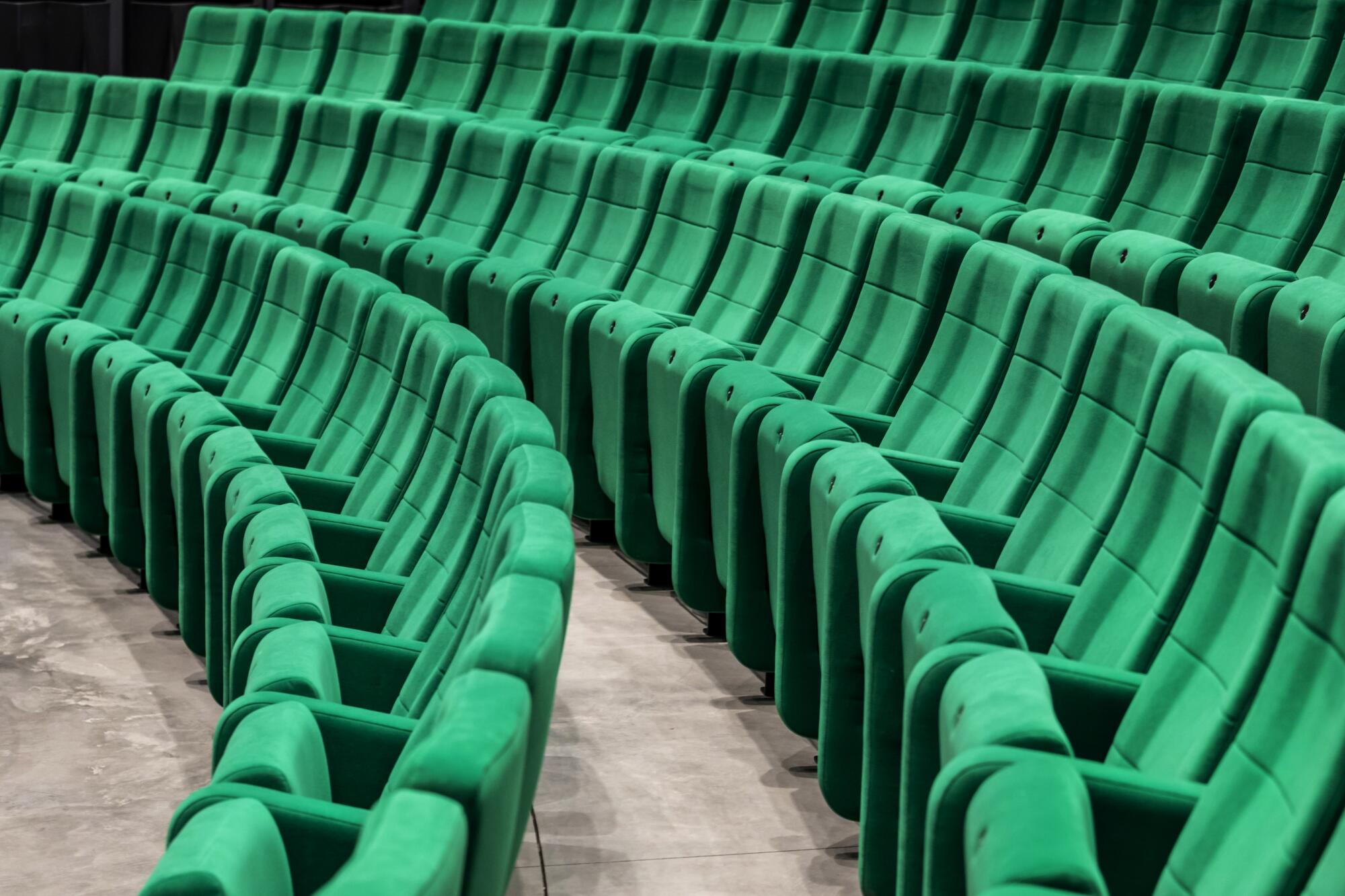 A view of the rows of green seats in the Academy Museum's Ted Mann Theater