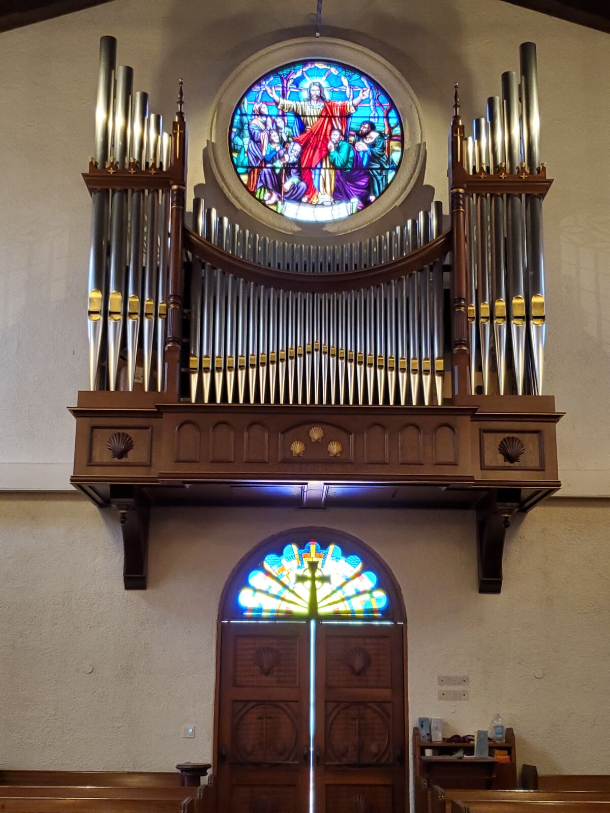 A portion of St. James by-the-Sea Episcopal Church's new pipe organ is mounted against the back wall of the church.