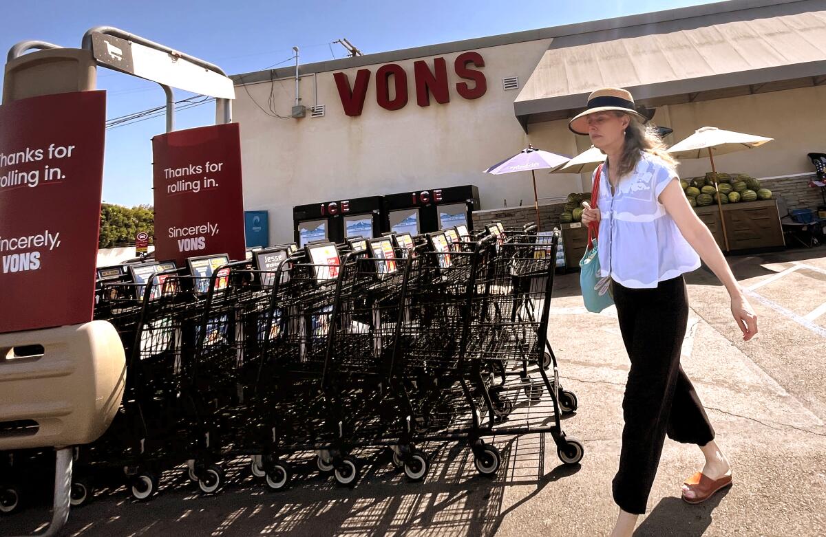 A shopper exits the Vons market in Westchester