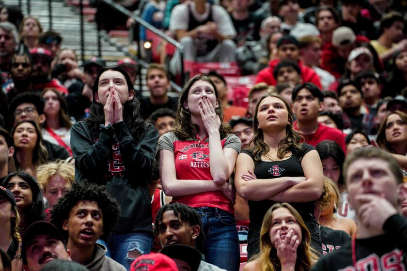 San Diego State Aztecs fans react as their team plays in the national championship game.