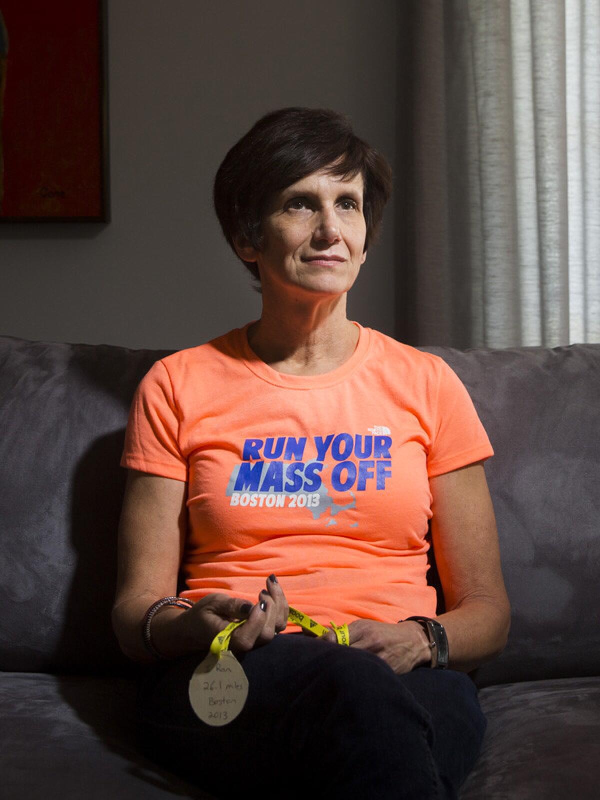 STUDIO CITY, CA -- APRIL 4, 2014--Runner Renee Opell, who attended the 2013 Boston Marathon but was unable to finish because of the bombing, is photographed in her Studio City home, April 4, 2014. (Jay L. Clendenin / Los Angeles Times)