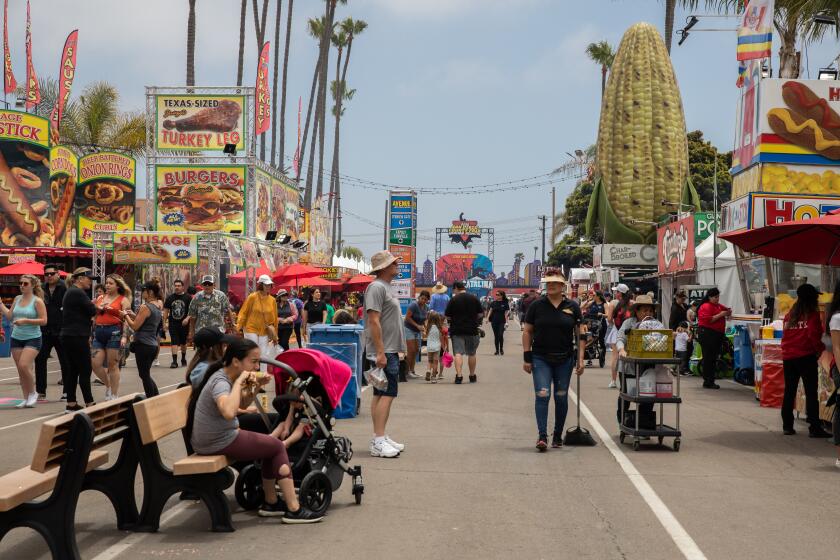 Del Mar, CA - June 08: Attendees walk through the main area of the San Diego County Fair Del Mar, CA on Wednesday, June 8, 2022. (Adriana Heldiz / The San Diego Union-Tribune)