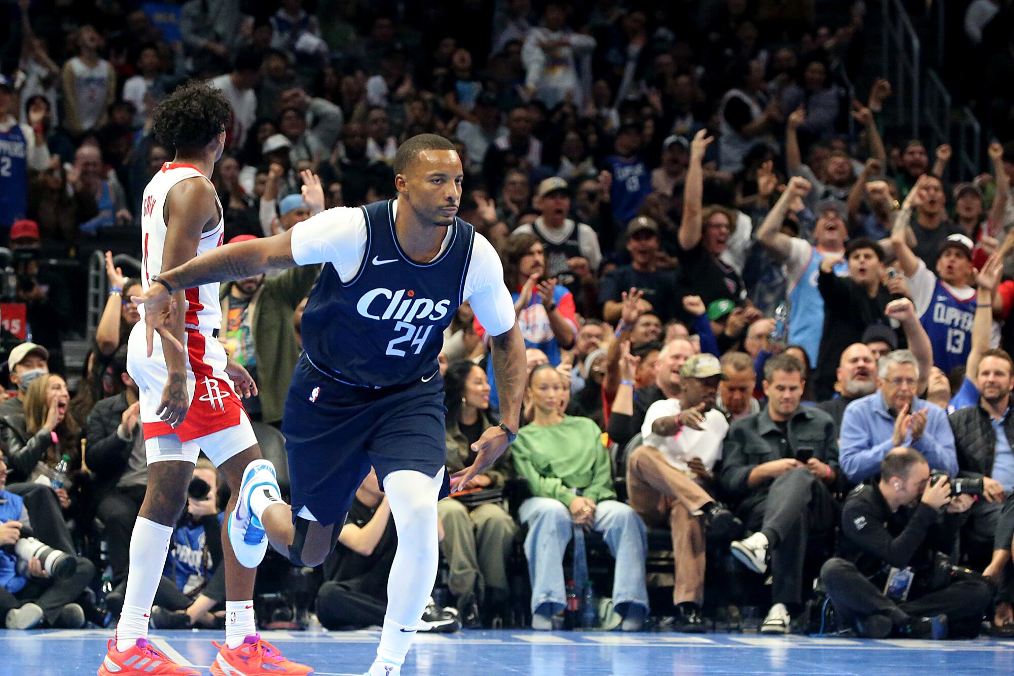 Clippers guard Norman Powell celebrates after hitting a three-pointer against the Rockets in a 106-100 victory in November
