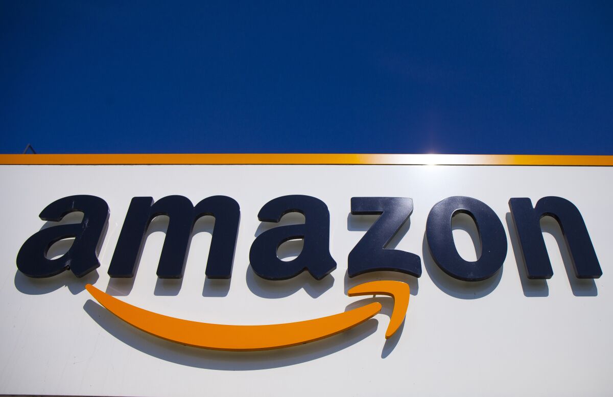 FILE - A view of the Amazon logo is displayed in Douai, northern France, April 16, 2020. Italy’s anti-trust authority on Thursday, Dec. 9, 2021 fined Amazon 1.13 billion euros, accusing it of exploiting its dominant position against third-party sellers on its site in such areas as logistics and product promotion in violation of EU competition rules. (AP Photo/Michel Spingler, File)
