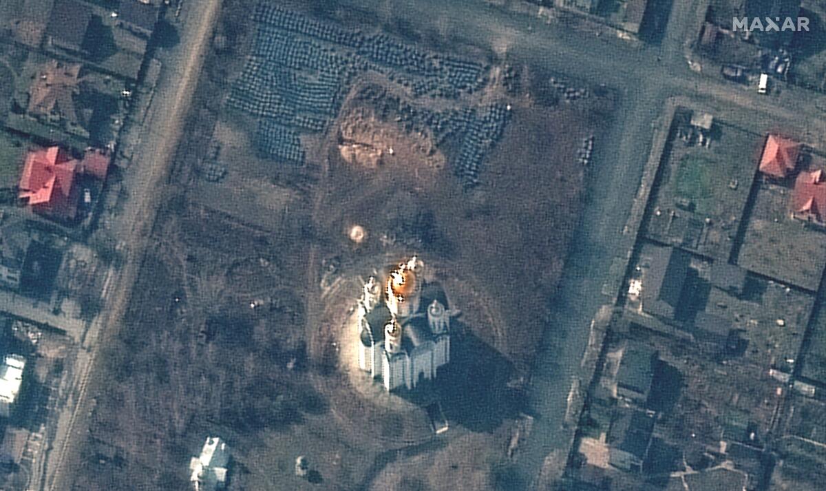 Aerial view of a church and probable mass grave site